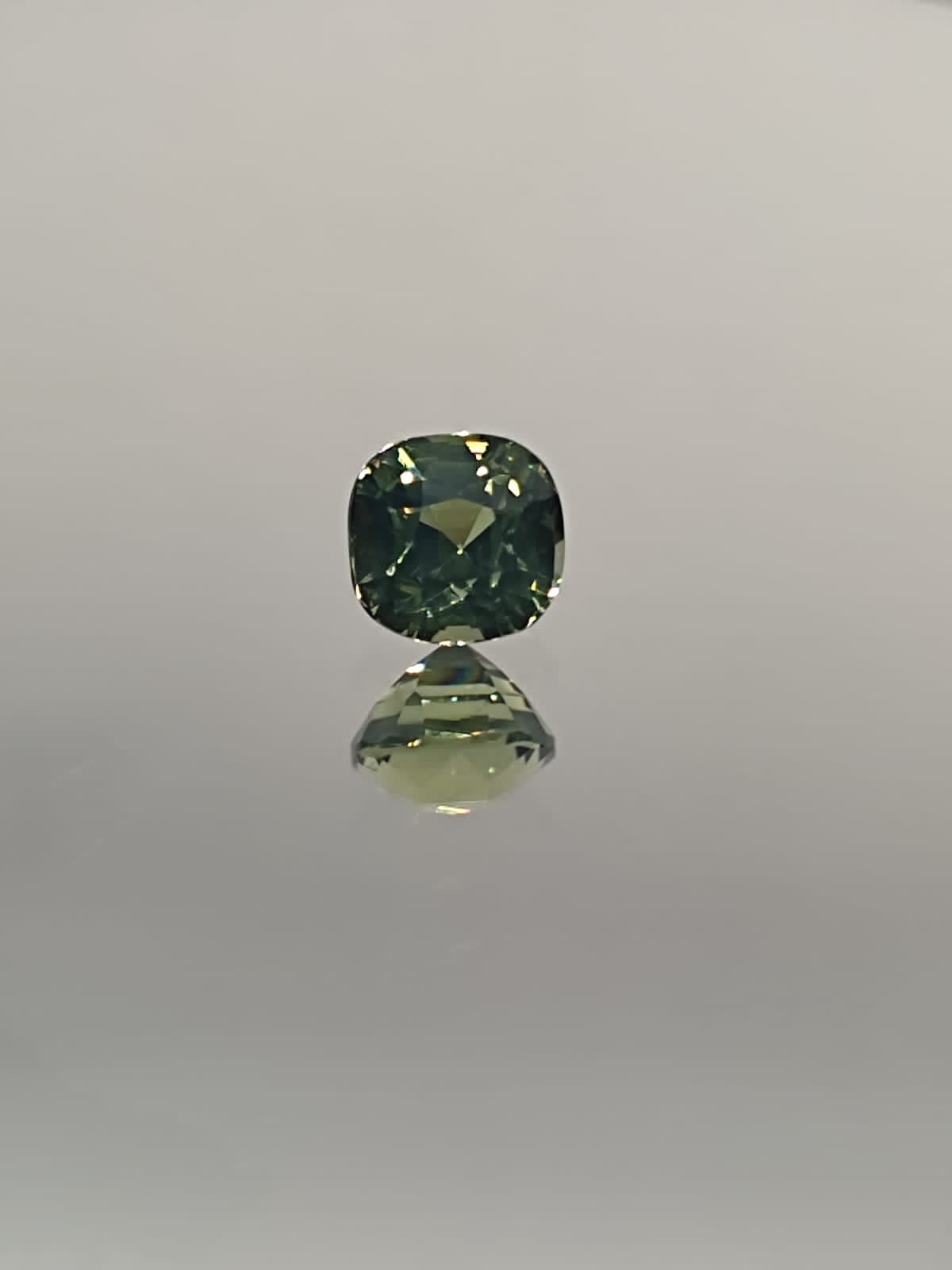 The Natural 1.58-Carat Green Sapphire: A Symbol of Renewal and Luxury