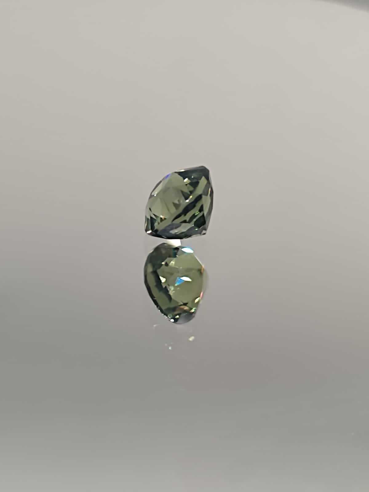 The Natural 1.58-Carat Green Sapphire: A Symbol of Renewal and Luxury